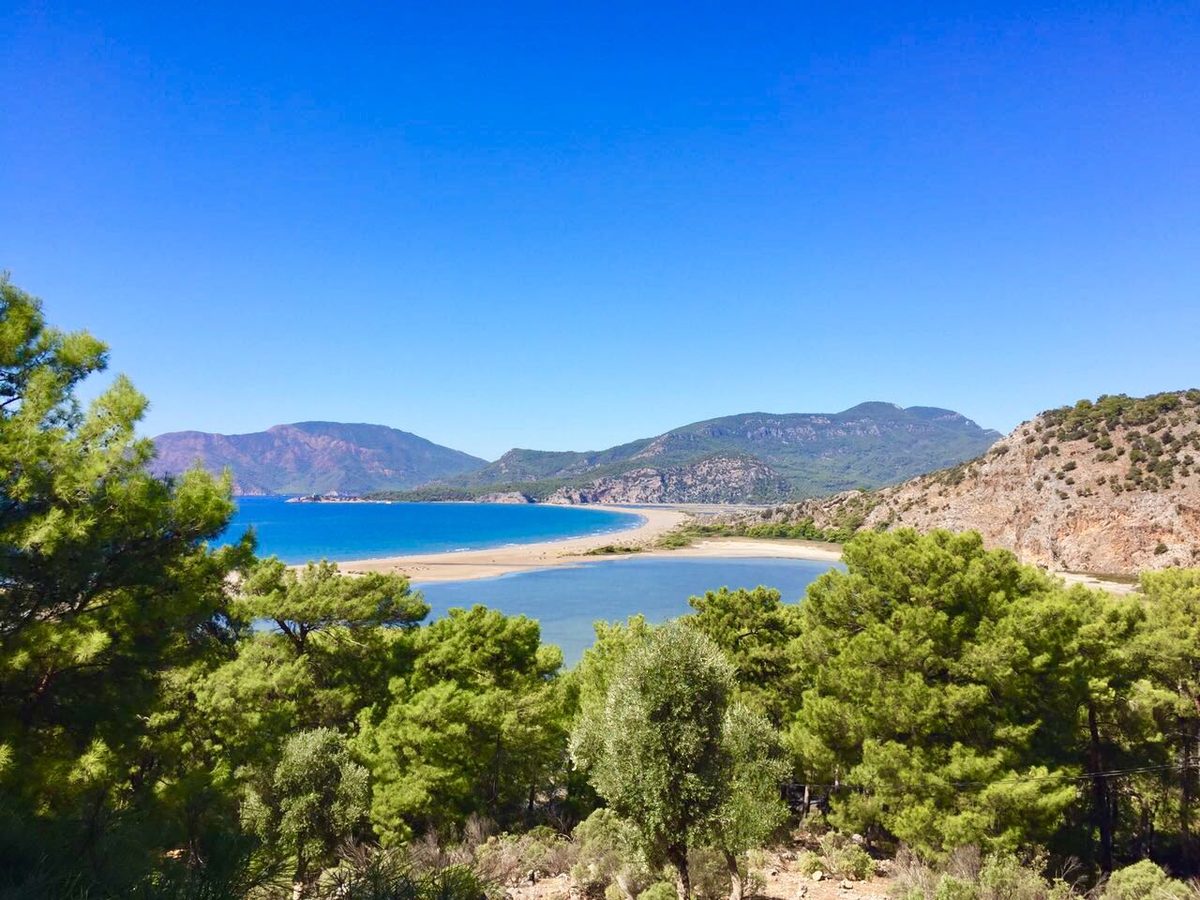 Iztuzu Beach — turquoise sea, white sand and pine-covered mountains